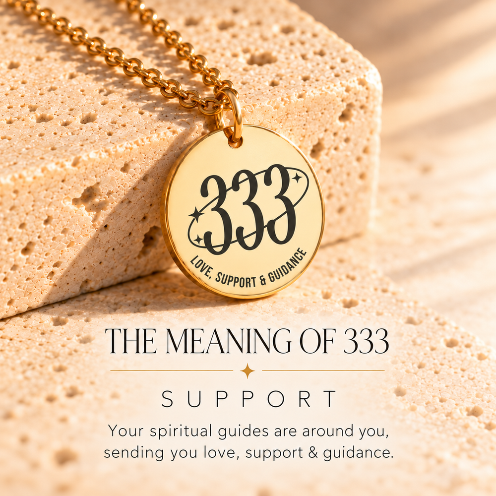 Round gold 333 angel number pendant on sunlit stone, engraved 'love, support and guidance' — 333 means support
