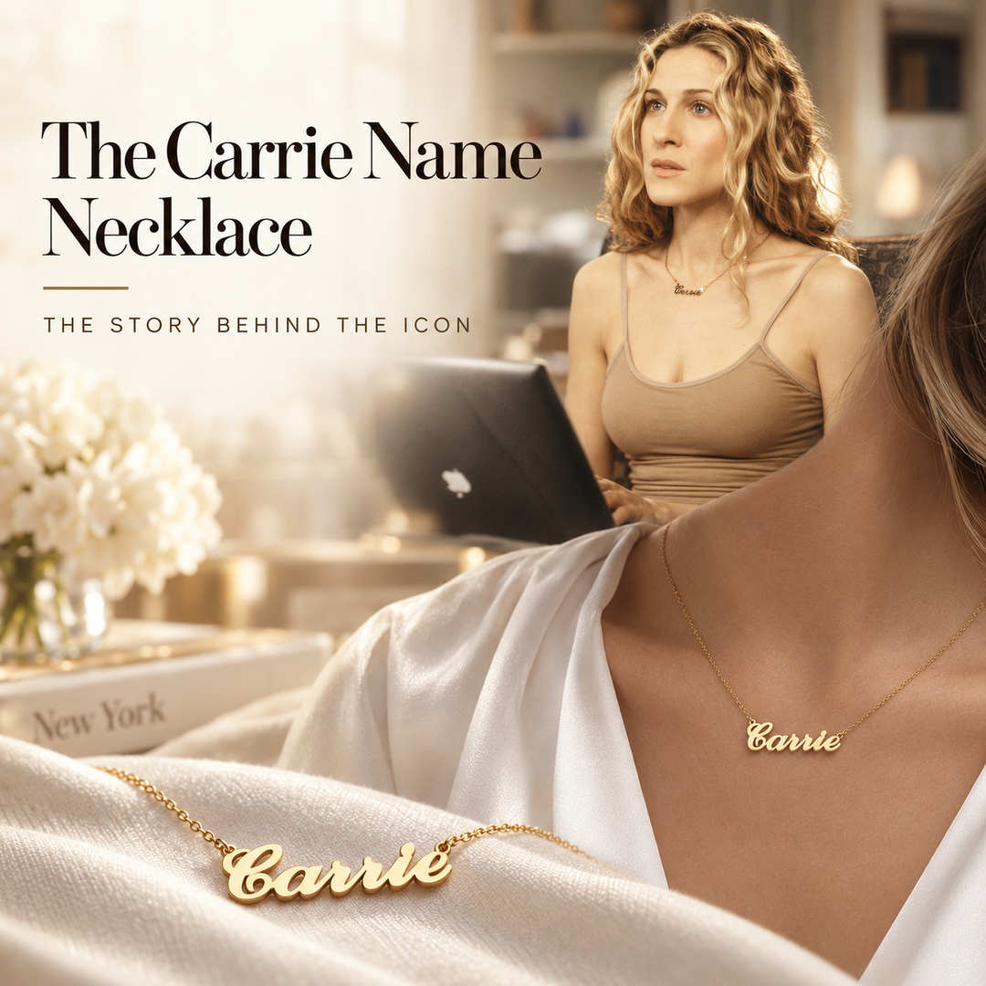 The Carrie Name Necklace, the story behind the icon — a gold script name necklace reading Carrie worn at the collarbone, with a second Carrie necklace laid on cream fabric