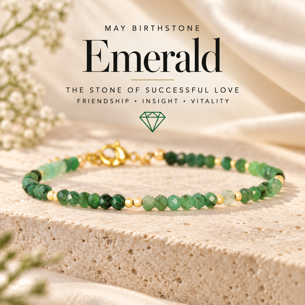 May Birthstone Emerald, the Stone of Successful Love — a green emerald and gold beaded bracelet on travertine, captioned Friendship · Insight · Vitality