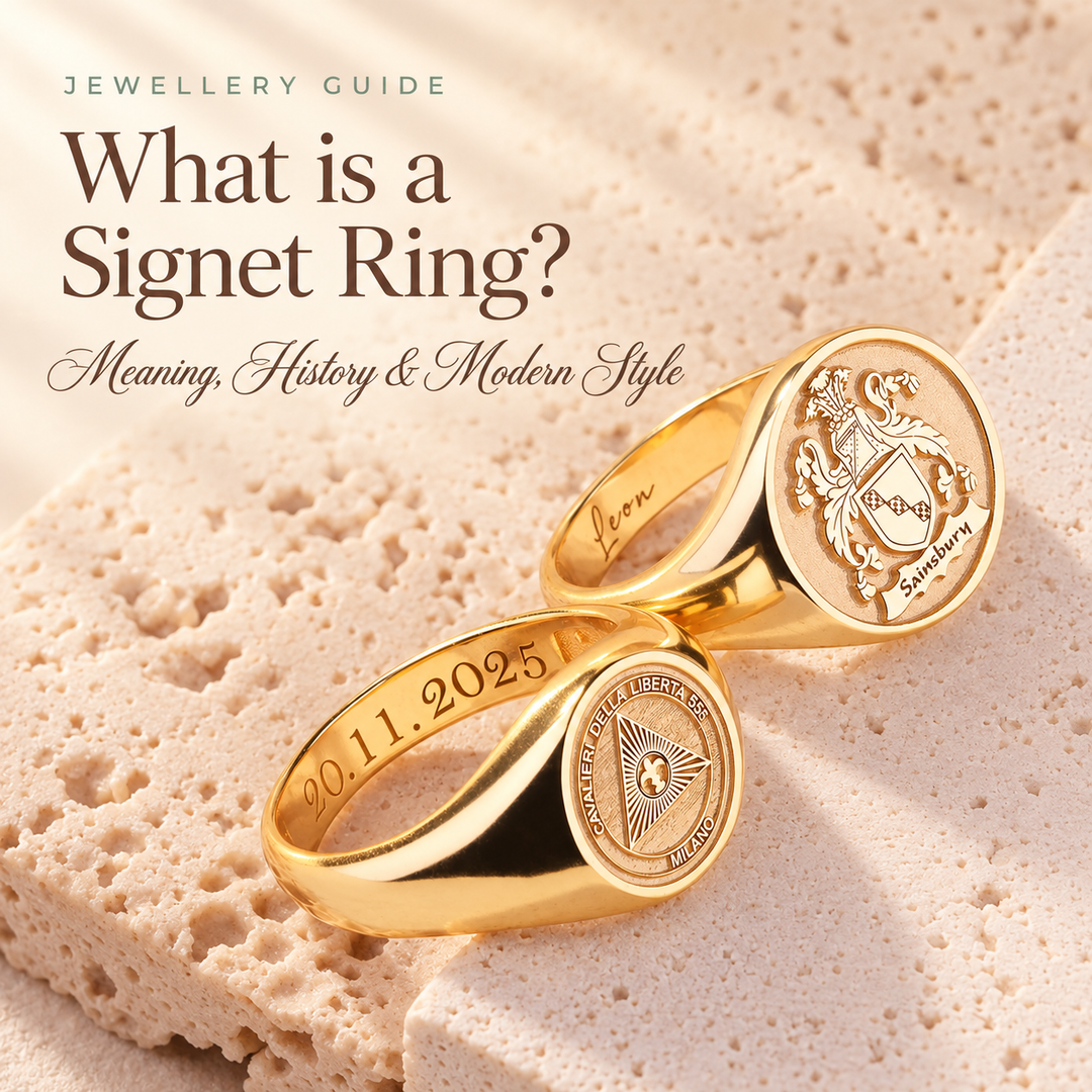 What is a Signet Ring? — three gold signet rings on stone, engraved with a family crest, a star motif and a date