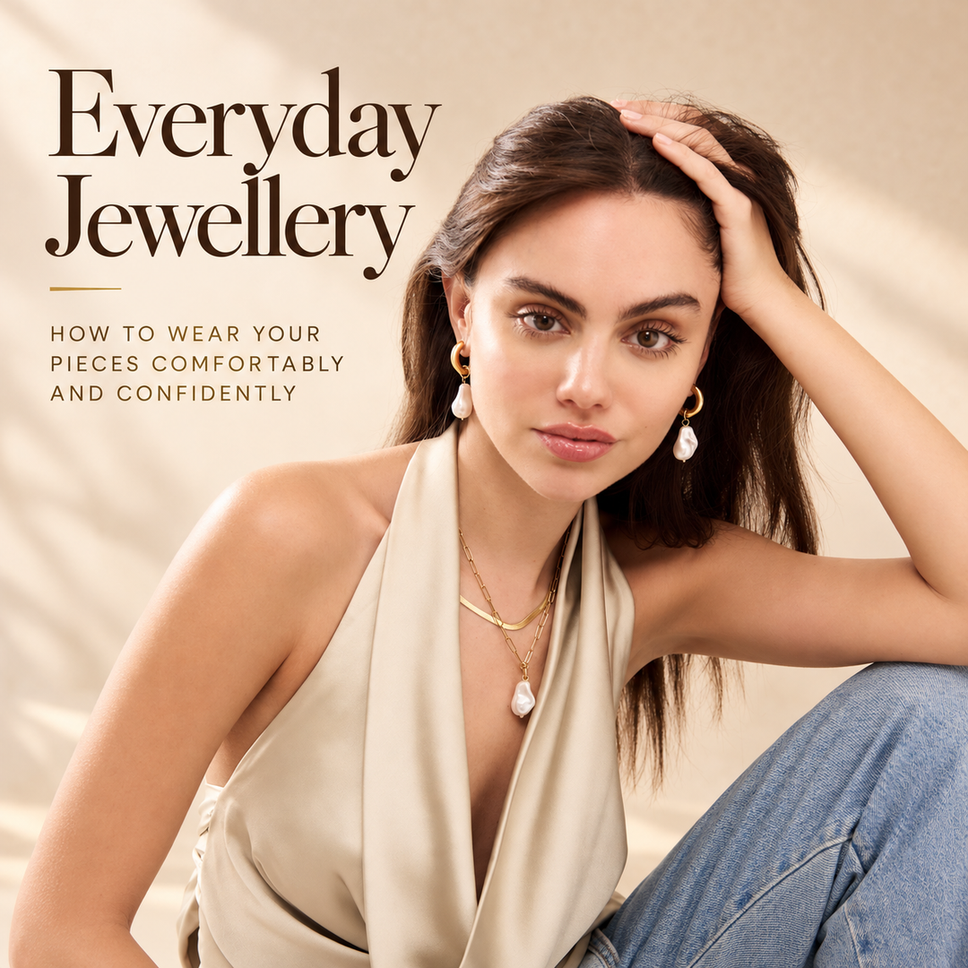 Everyday Jewellery, how to wear your pieces comfortably and confidently — a woman in a cream satin top wearing baroque pearl drop earrings and two layered gold chains with a pearl pendant