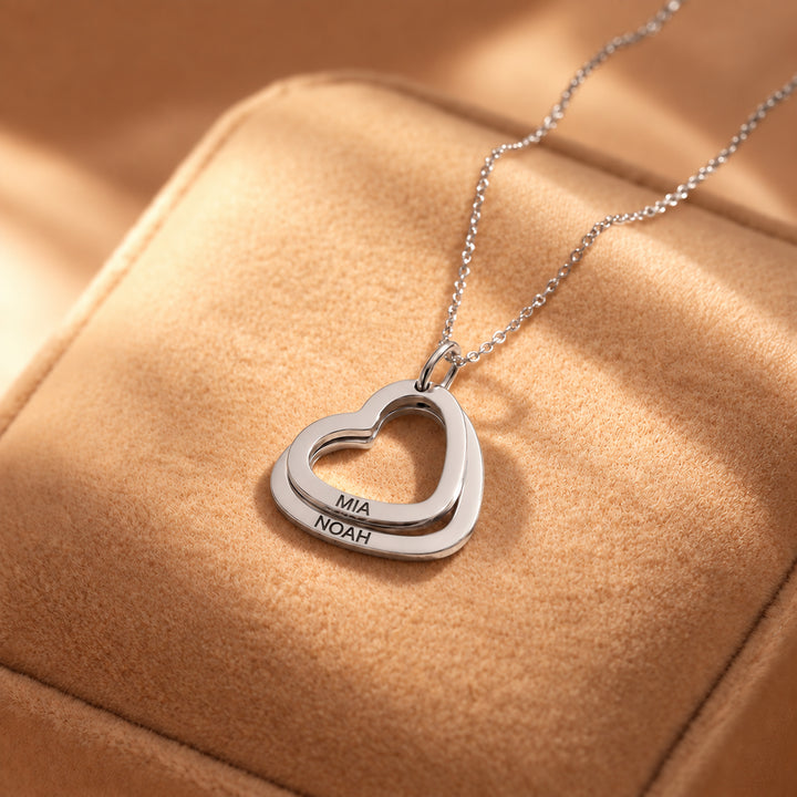 Silver heart necklace with two hearts engraved with names