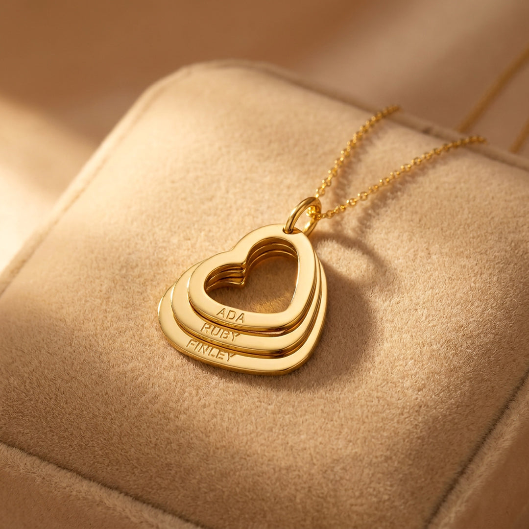 Gold family heart necklace with three nested hearts engraved with names