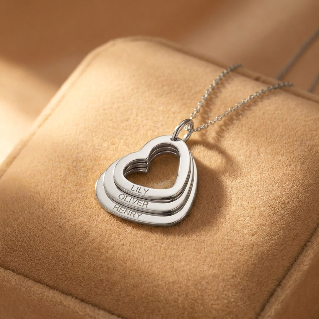Silver family heart necklace with three engraved hearts