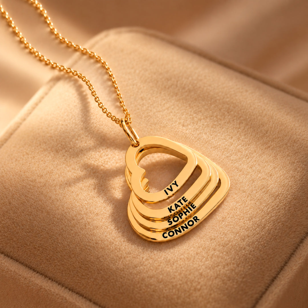 Gold family heart necklace with four hearts engraved with children&