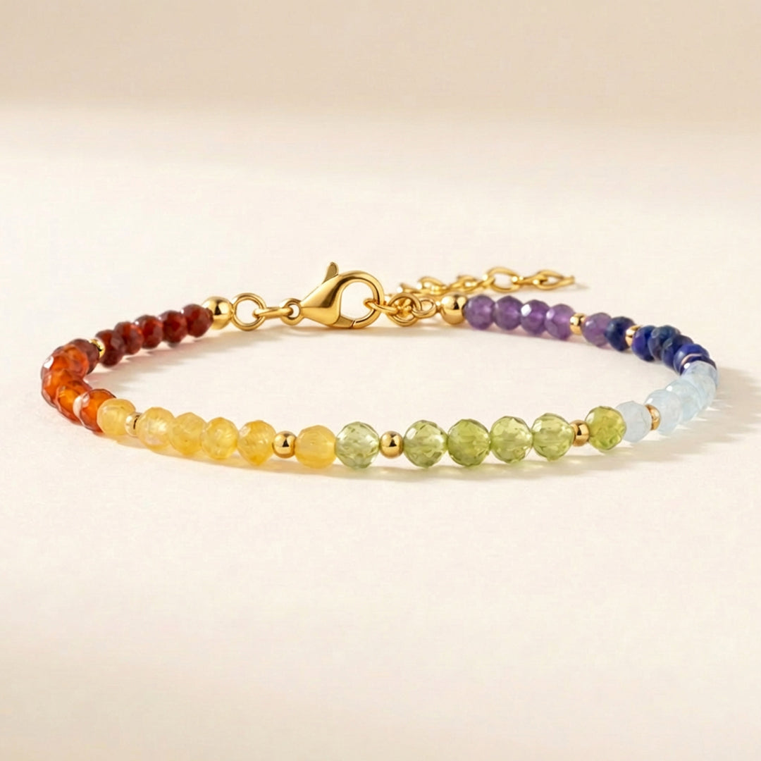 Close up of 7 chakra gemstone bracelet including amethyst, lapis lazuli, peridot and carnelian