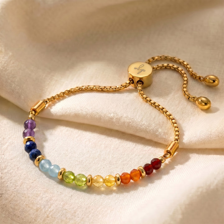 Gold healing chakra bracelet with 7 genuine chakra stones on adjustable slider chain
