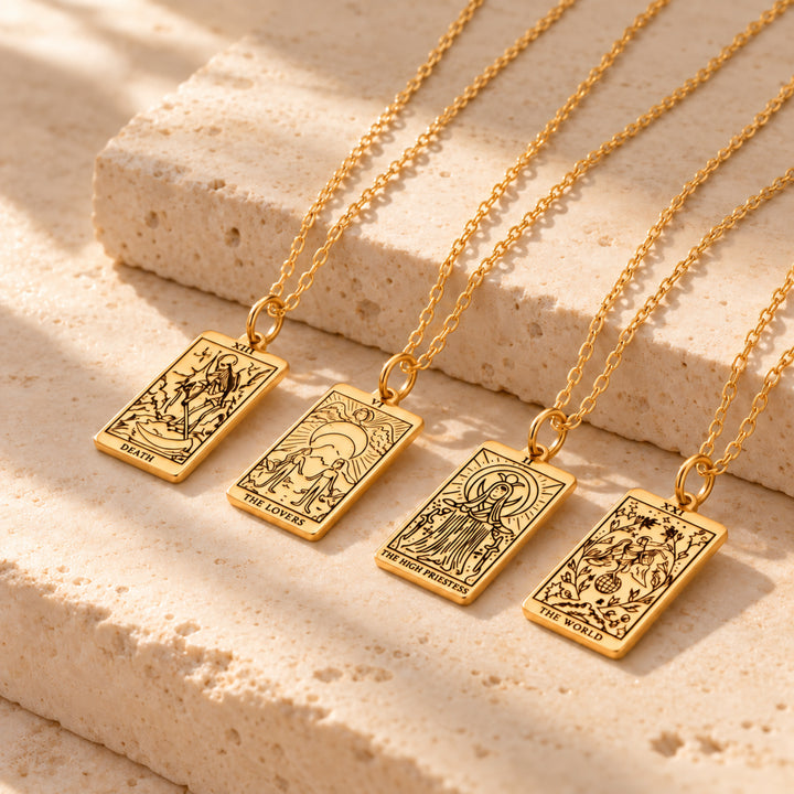 Four tarot card necklaces in 18K gold plated, layered together