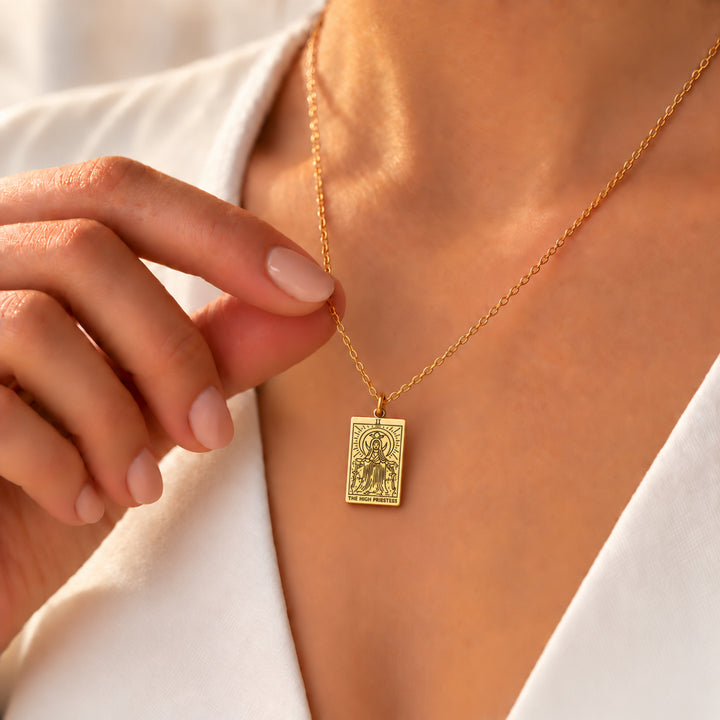 Woman wearing The High Priestess tarot necklace in 18K gold plated