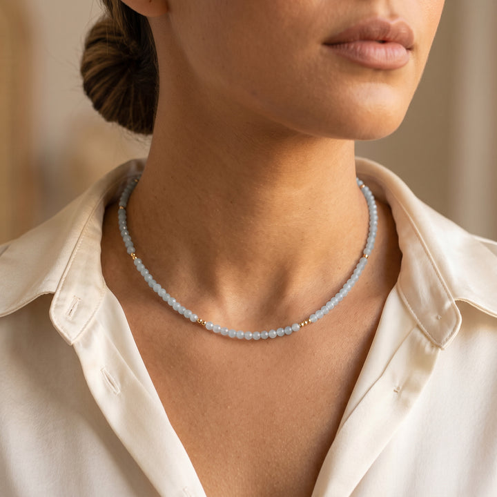 Real aquamarine necklace on model — hand-strung in our Chester studio, March birthstone