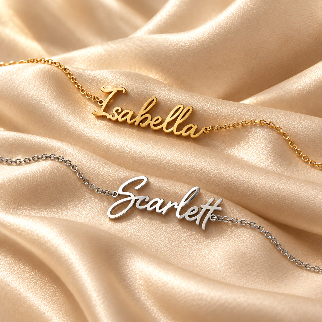 Gold and silver script name bracelets side by side, each with a name in flowing script