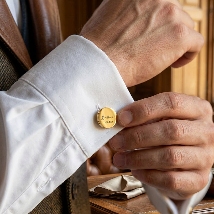 Man fastening gold best man cufflinks on shirt cuff, personalised wedding accessory