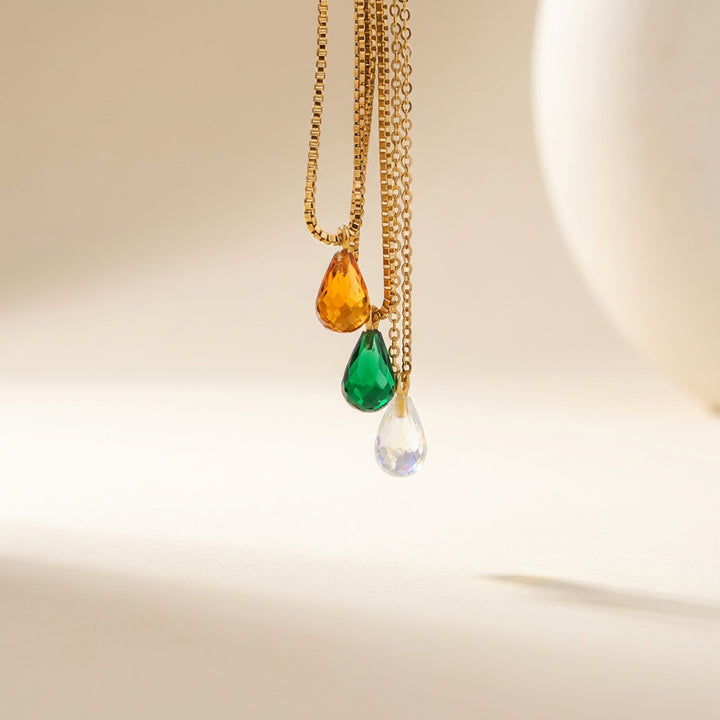 Faceted teardrop crystal birthstone pendants— close-up showing colour and faceting