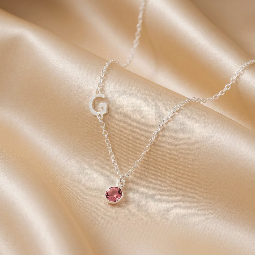 Silver sideways initial necklace with crystal birthstone