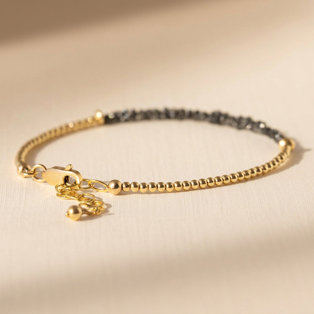 Clasp and extender detail — 2mm metal beads strung to lobster clasp with extender chain