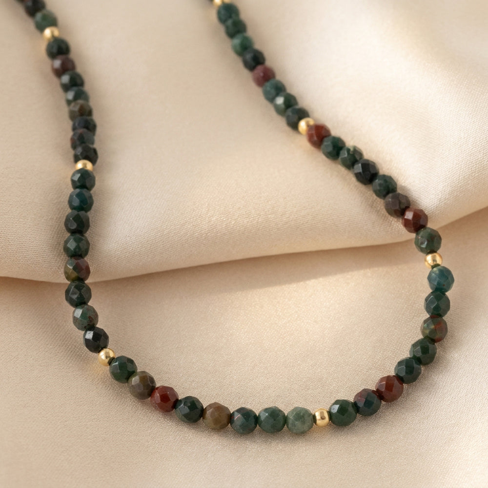Real bloodstone necklace close-up — 4mm diamond-cut beads, deep green with characteristic red flecks