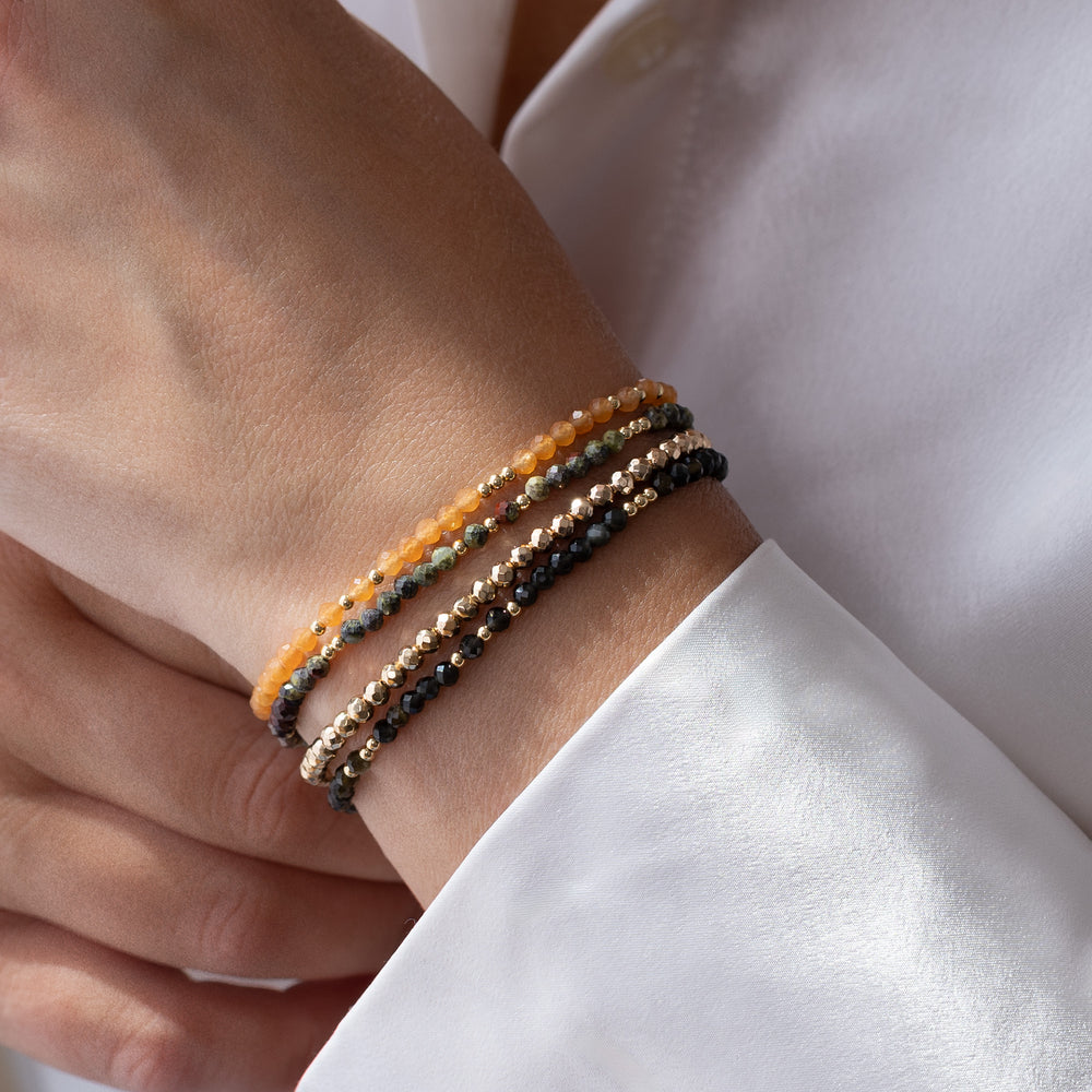 14K gold filled orange aventurine bracelet stacked with other Abiza Skinny bracelets