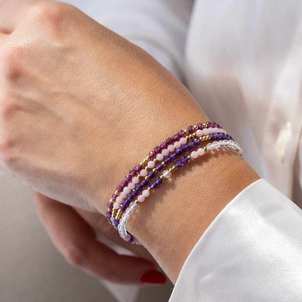 14K gold filled rhodolite garnet bracelet stacked with other Abiza Skinny bracelets