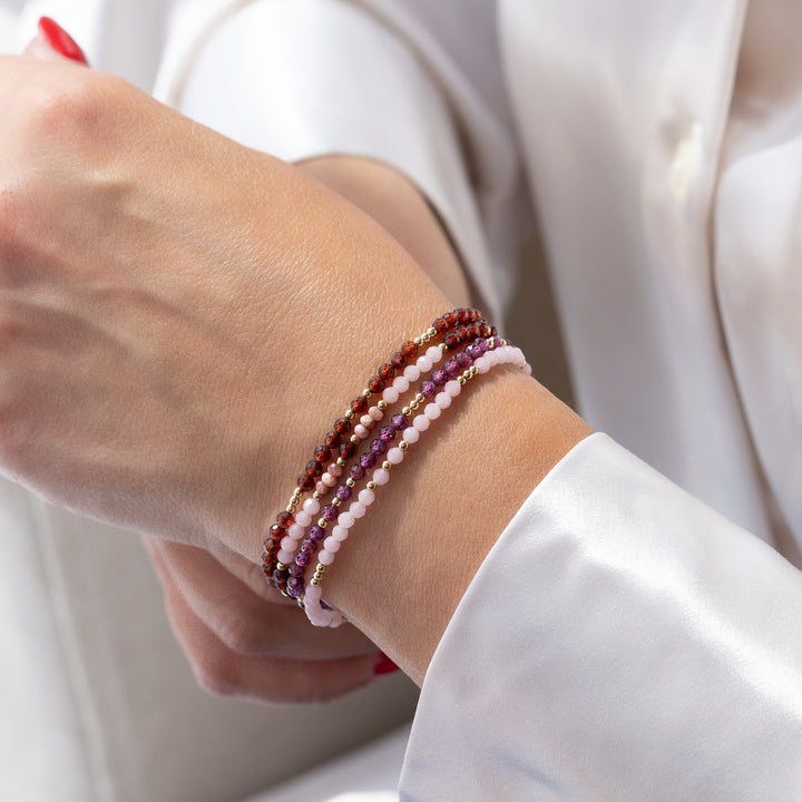 14K gold filled Garnet bracelet stacked with other Abiza Skinny bracelets