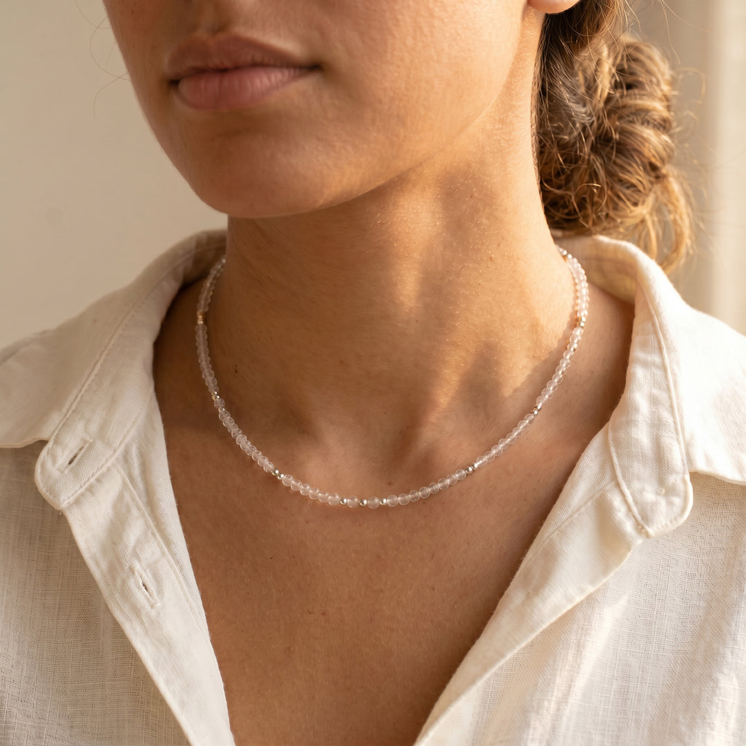 Real clear quartz necklace on model — luminous 3mm diamond-cut detail, hand-strung close-up