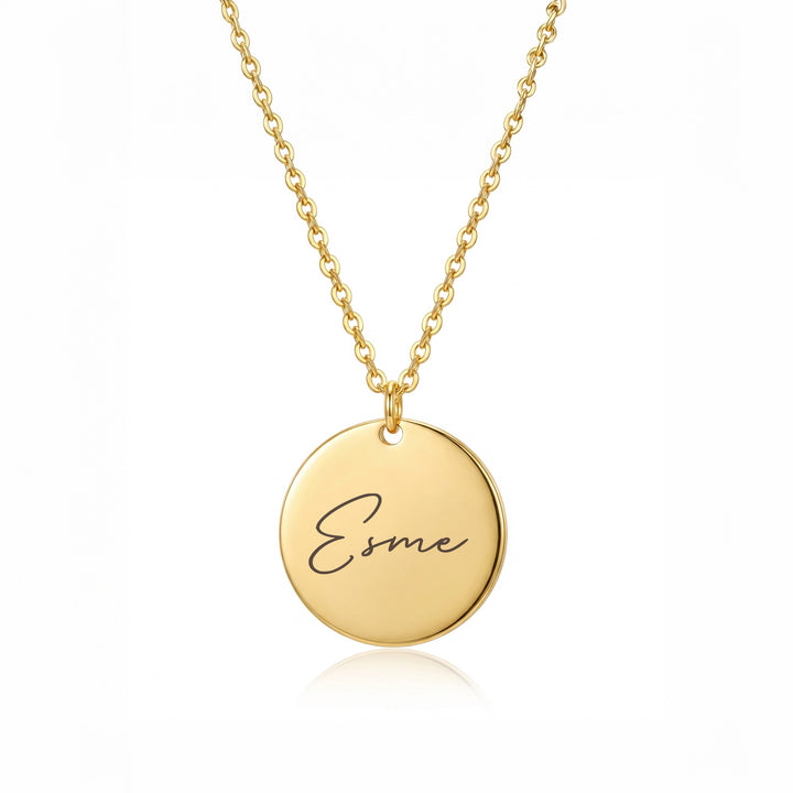 Gold personalised disc necklace with name Esme engraving close-up