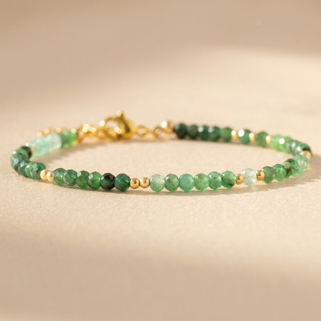 Natural emerald beads close-up — diamond cut, May birthstone bracelet