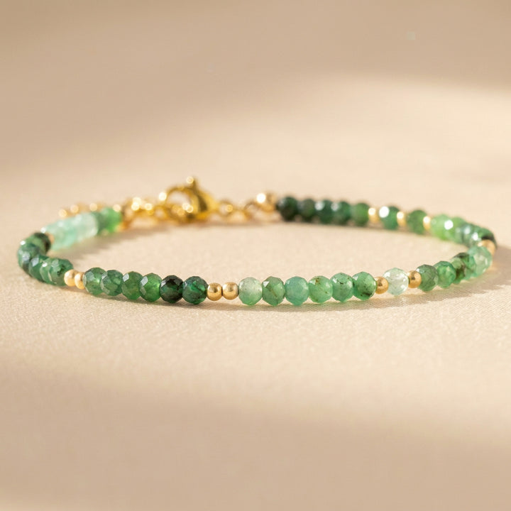Natural emerald beads close-up — diamond cut, May birthstone bracelet