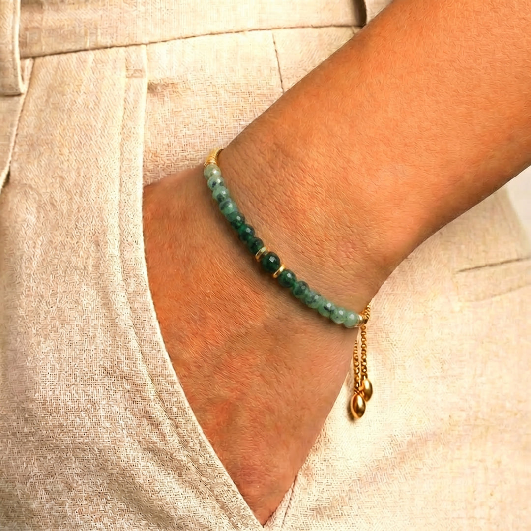 Model wearing Abiza May birthstone emerald bracelet on wrist