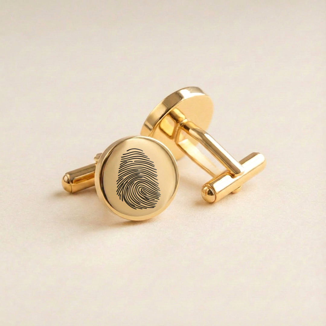 Gold cufflinks engraved with fingerprint