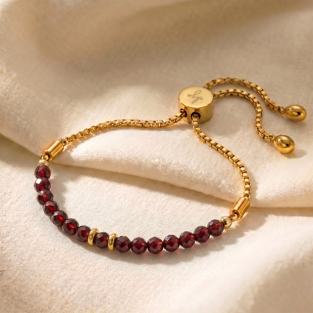 Gold January birthstone garnet bracelet with 4mm genuine red garnet beads on adjustable slider chain
