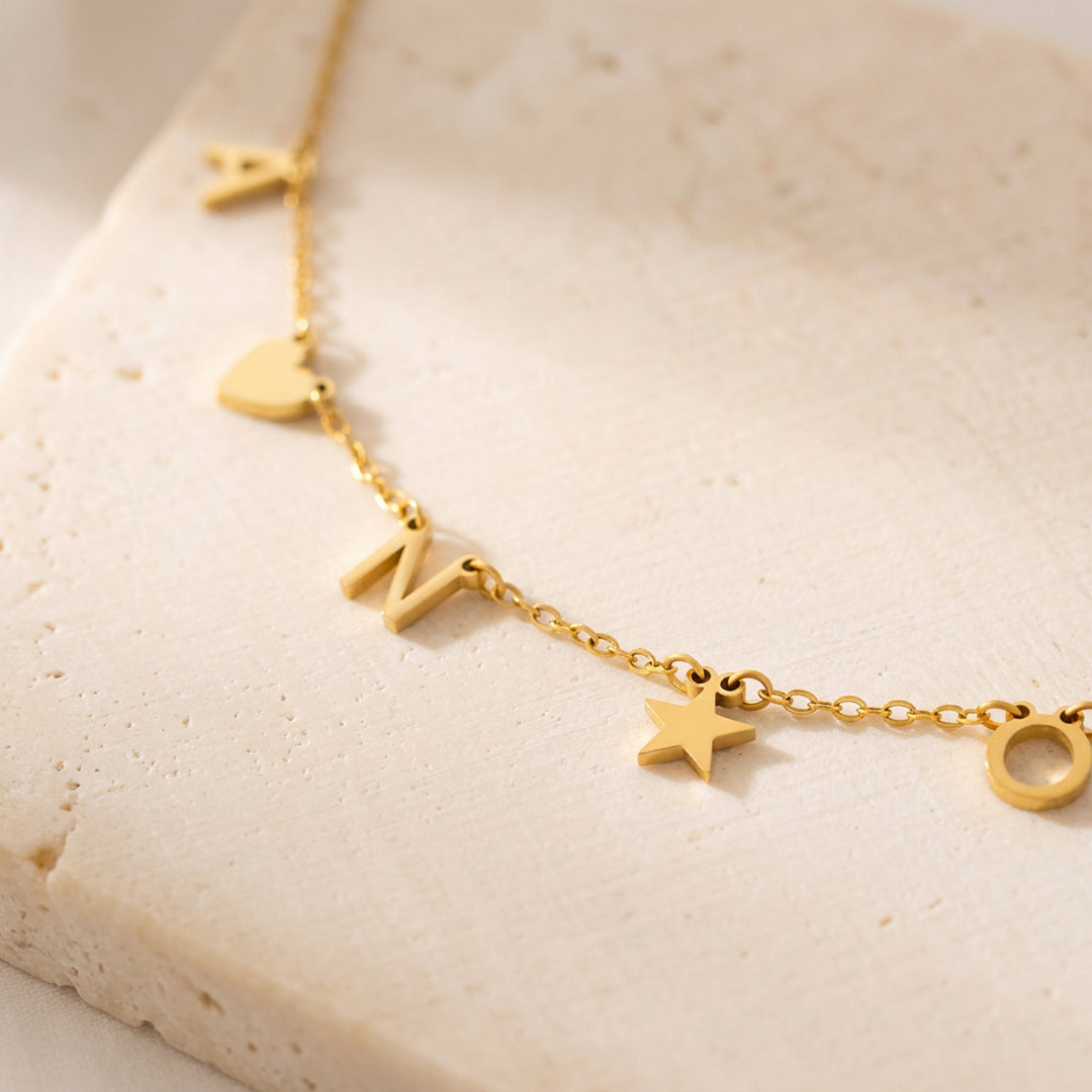 Dainty initial necklace shown with multiple letters — flexible character count