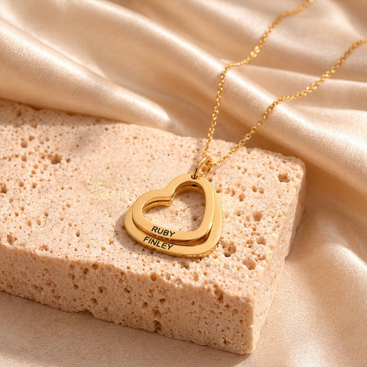 Gold heart necklace with two engraved hearts on a fine chain