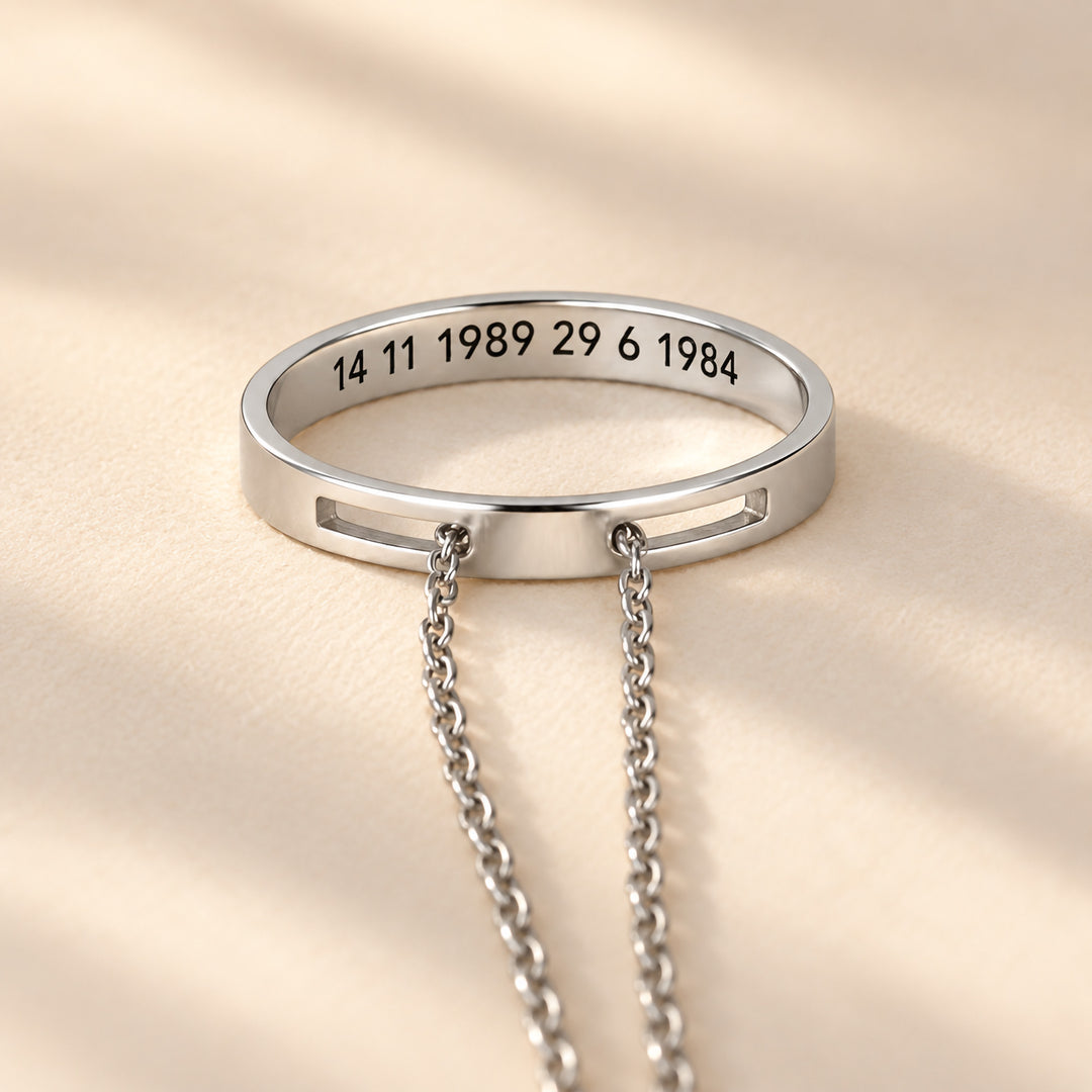 Silver circle necklace with dates engraved on the inside