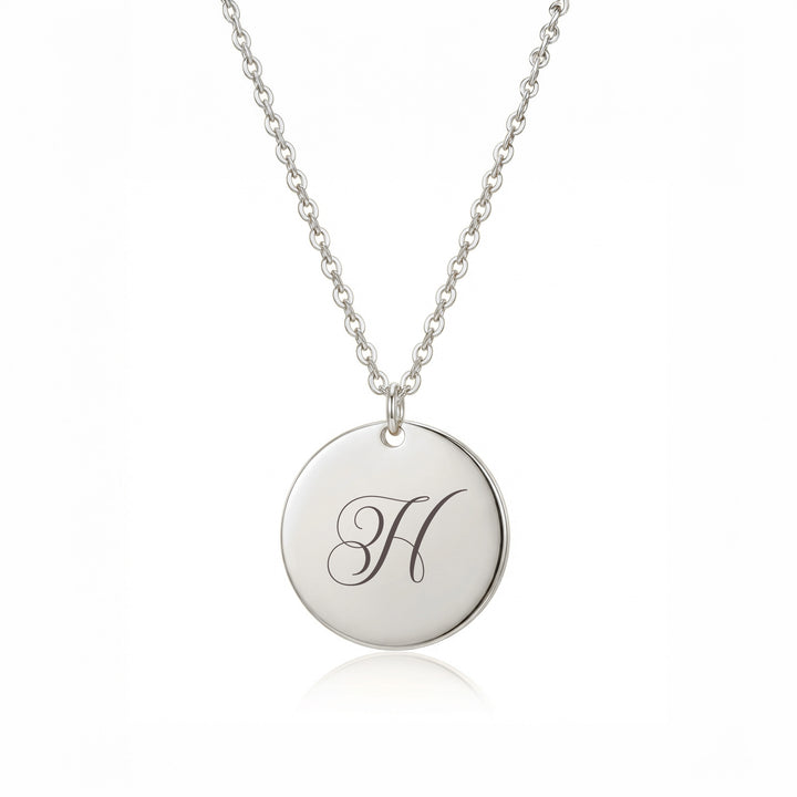 Silver initial disc necklace with engraved script letter H