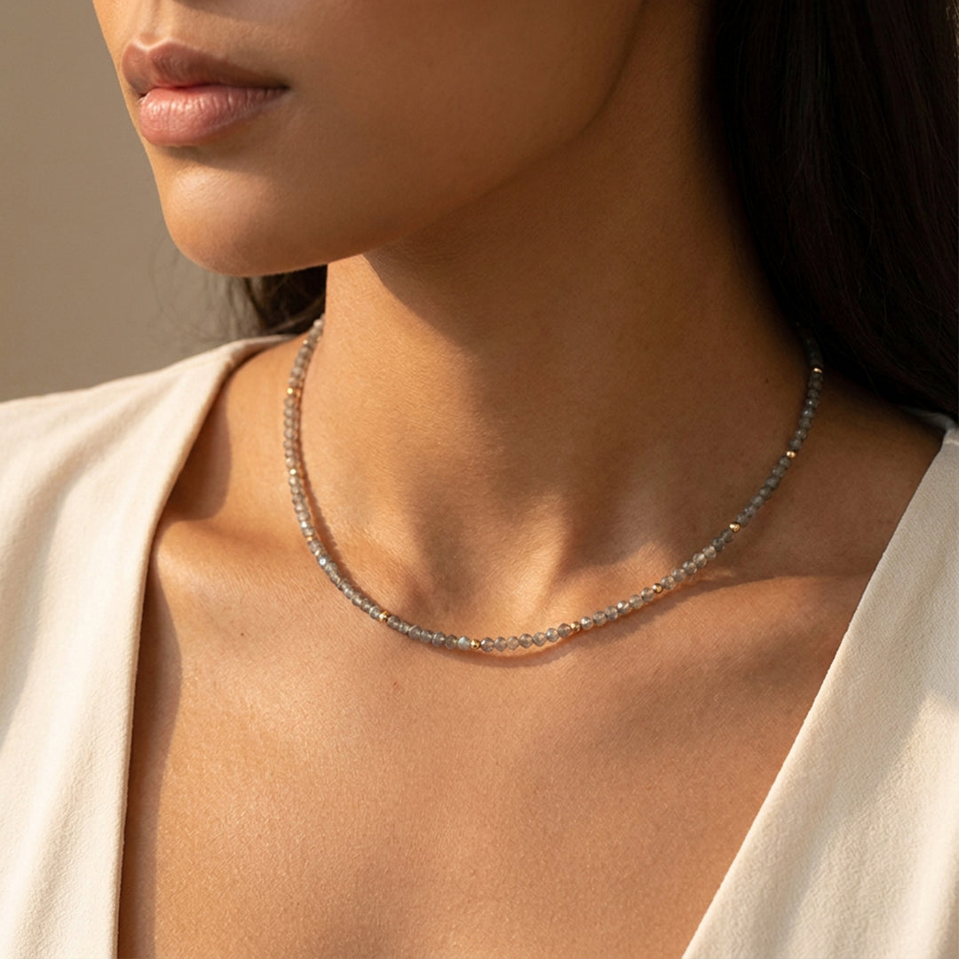 Real labradorite necklace on model — hand-strung, showing the iridescent labradorescence flash