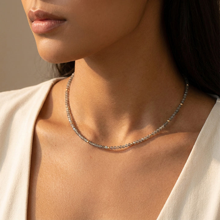 Real labradorite necklace on model — hand-strung, showing the iridescent labradorescence flash