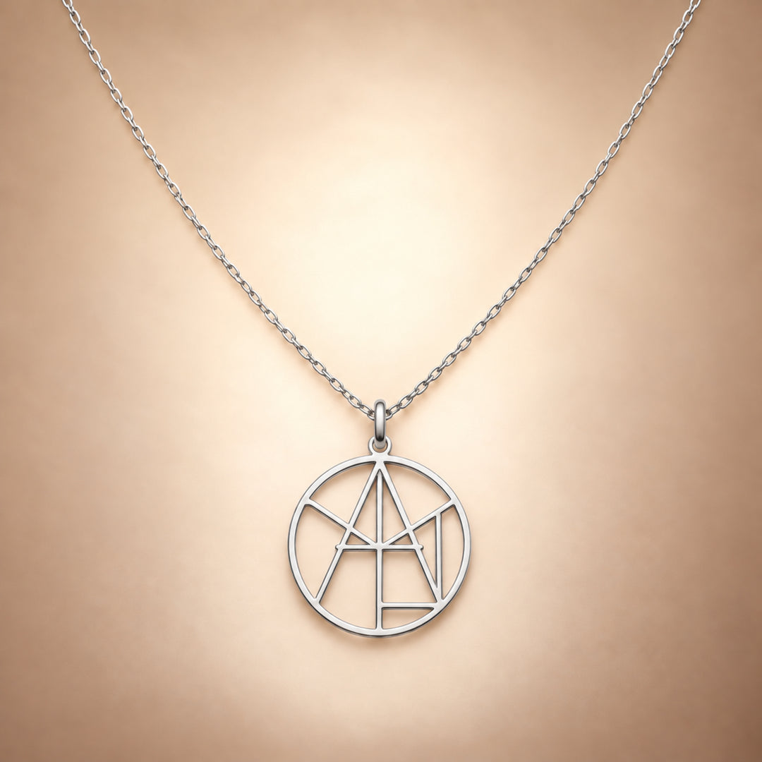 Silver monogram name necklace with the name Aylin cut through the circle