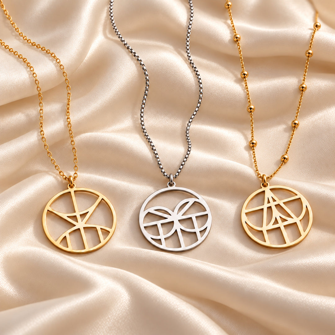 Monogram name necklaces in gold and silver on cable, box and satellite chains