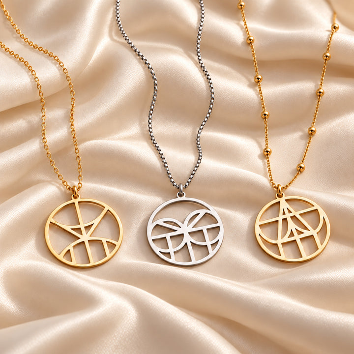 Monogram name necklaces in gold and silver on cable, box and satellite chains