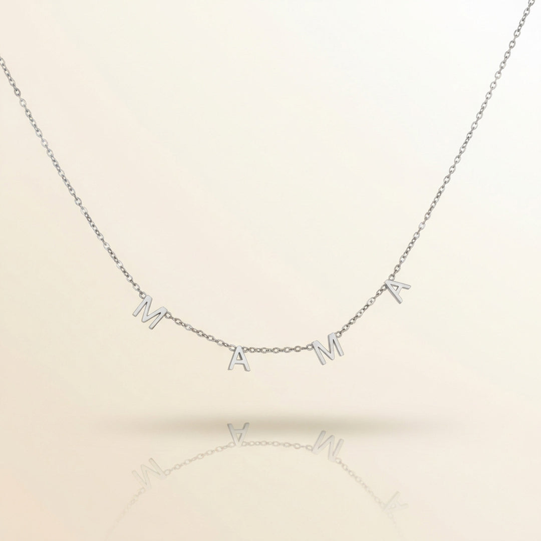 Silver necklace with 'MAMA' letters on a beige background