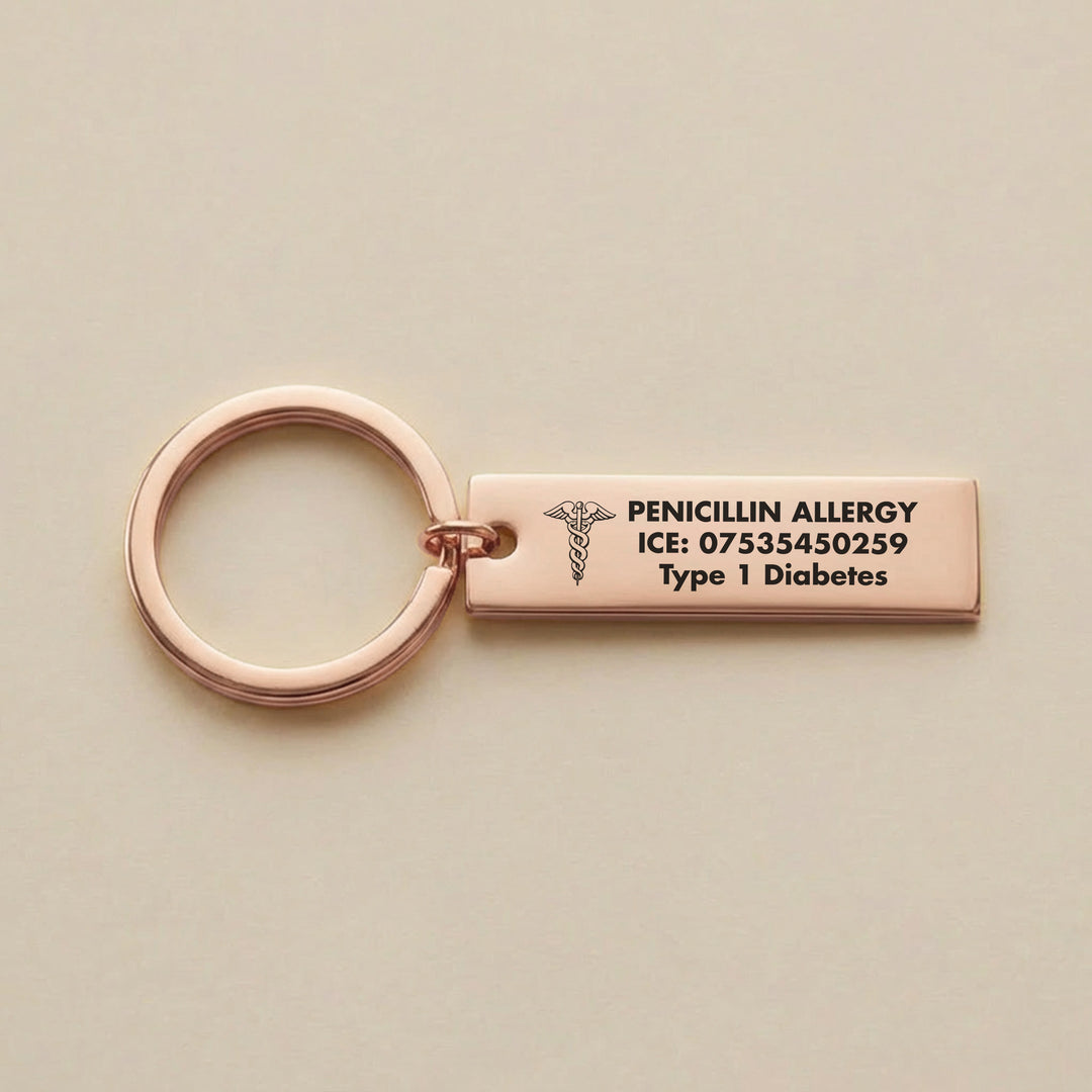 Rose gold medical alert keyring engraved with penicillin allergy and emergency contact details