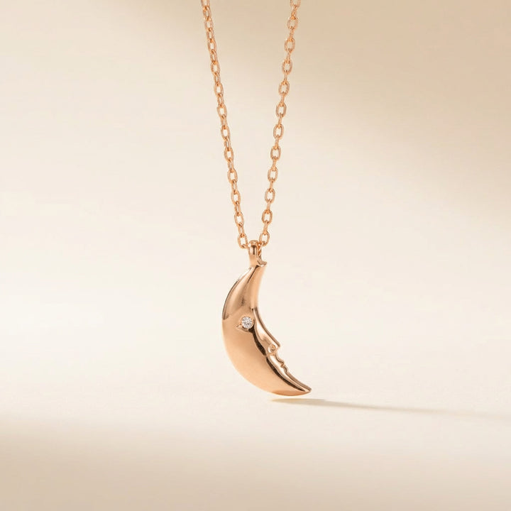 Rose gold crescent moon necklace pendant on delicate chain