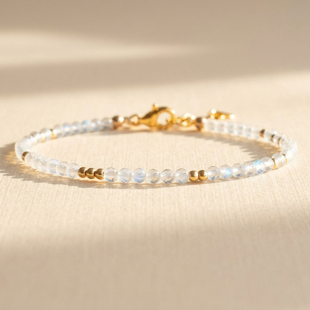14k gold filled skinny rainbow moonstone bracelet showing the blue flash in each real moonstone bead