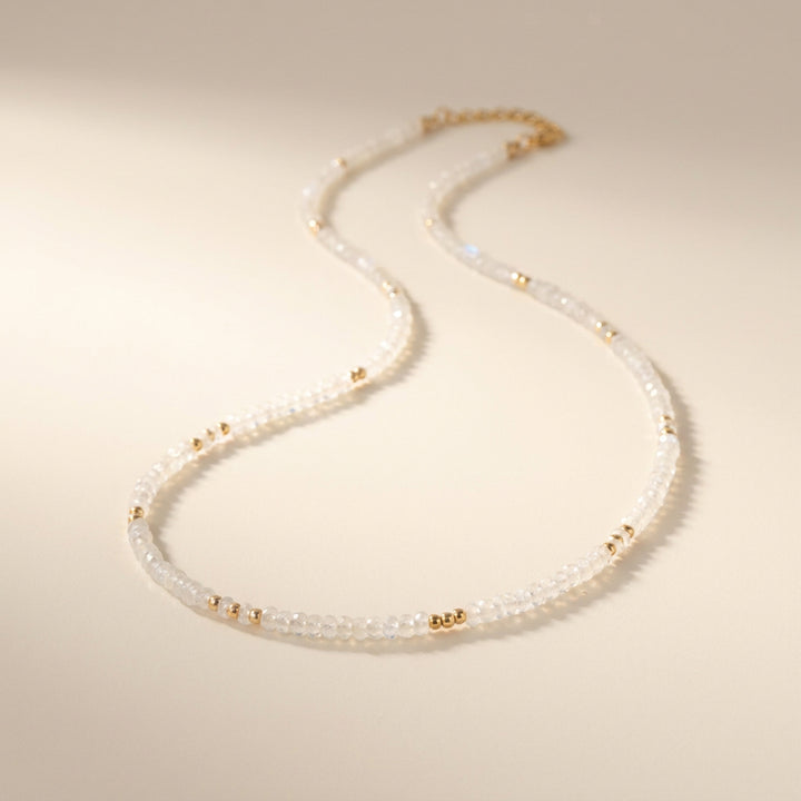 Real rainbow moonstone necklace — soft blue flash on 3mm hand-cut faceted rondelles, hand-strung detail