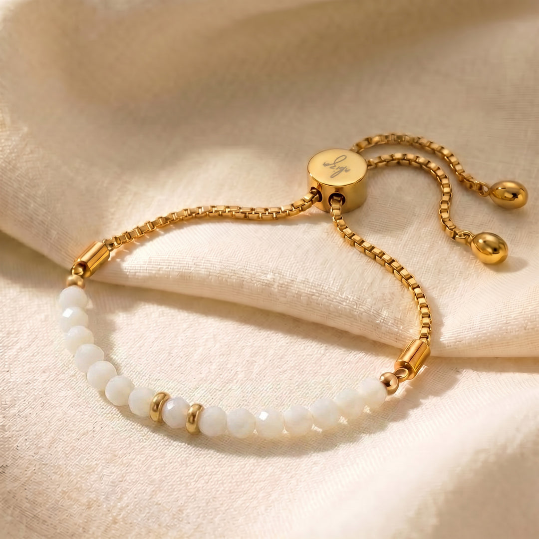 Gold mother of pearl bracelet with iridescent white mother of pearl beads on adjustable slider chain