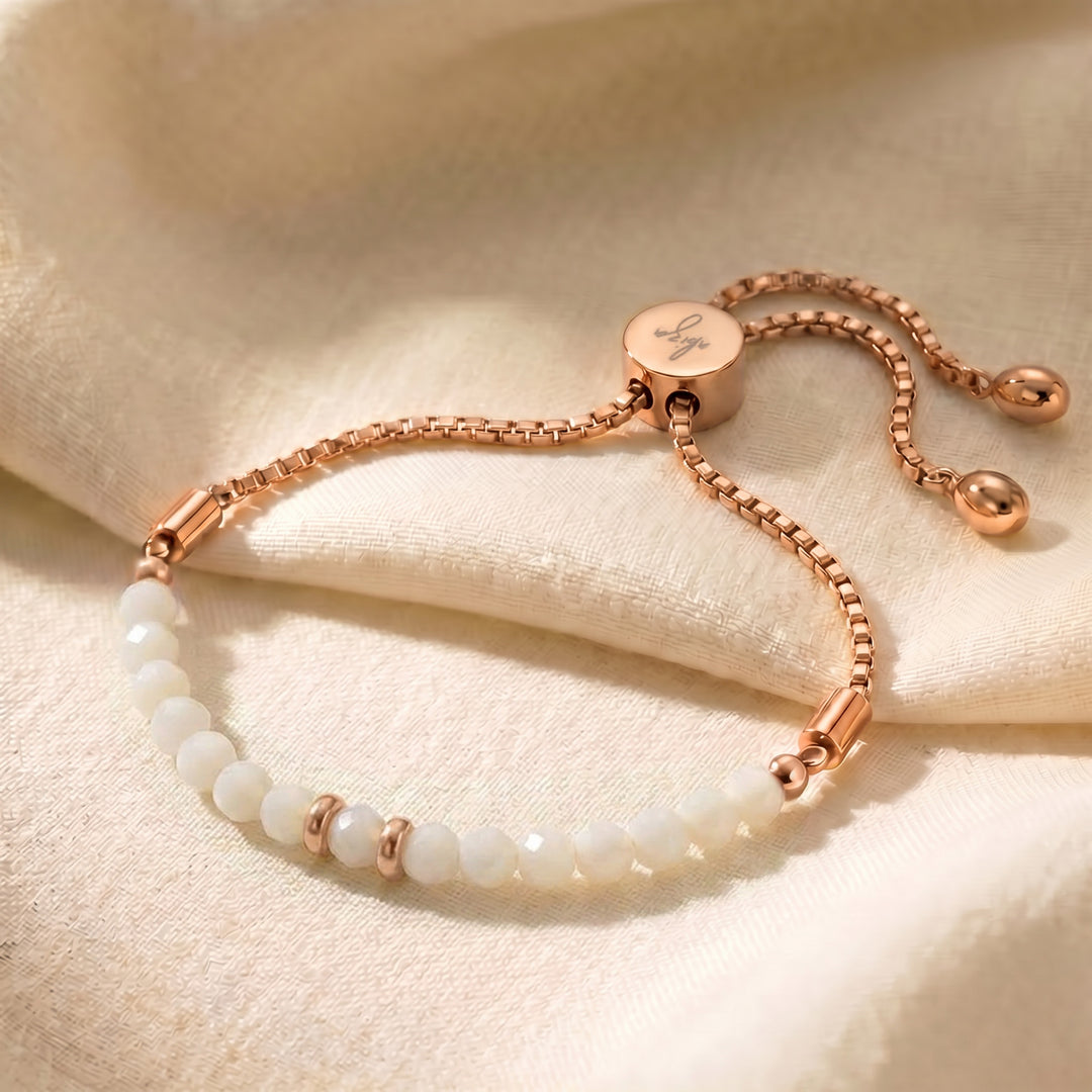 Rose gold mother of pearl bracelet with iridescent white beads, adjustable slider chain