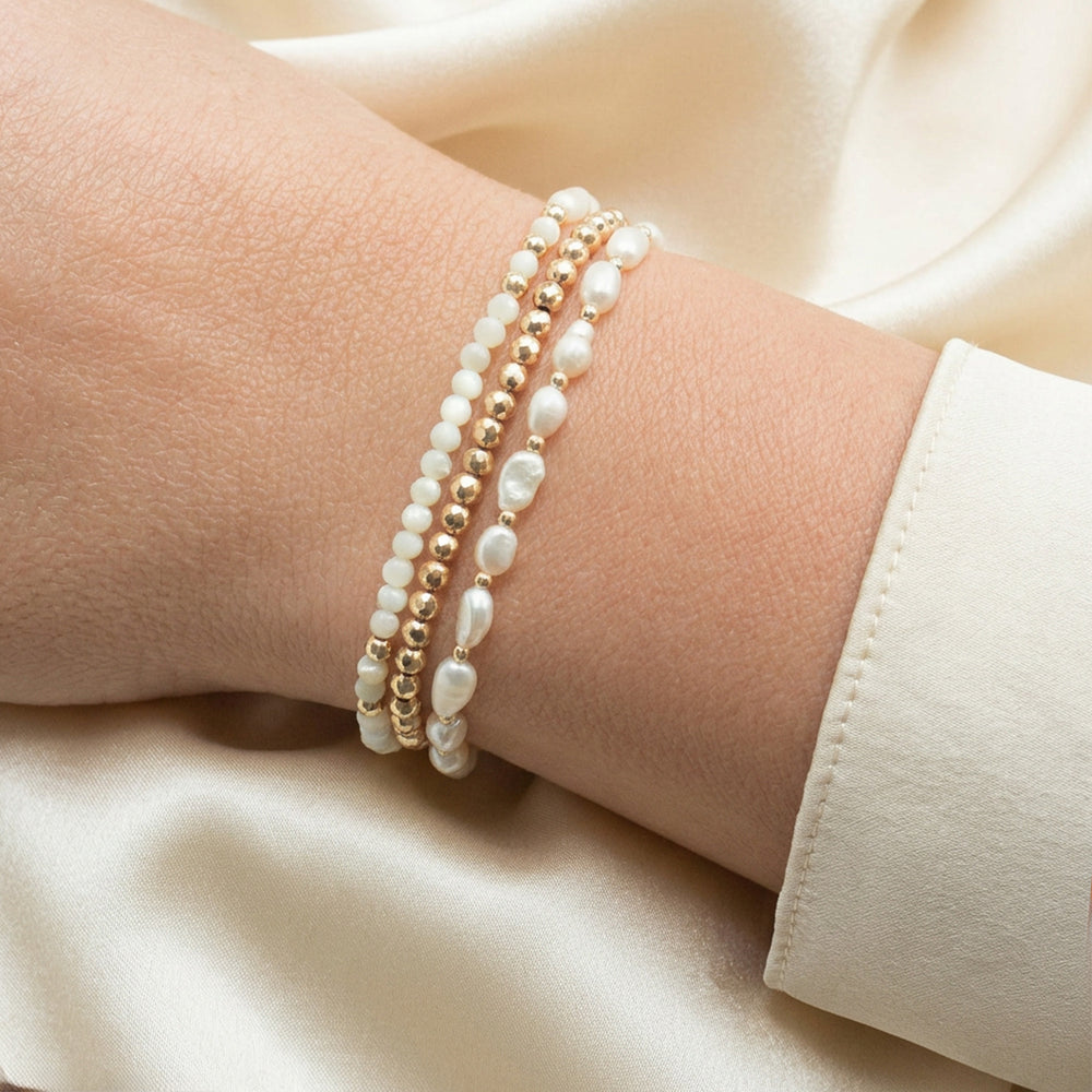 Pearl bracelet stacked with other Abiza bracelets