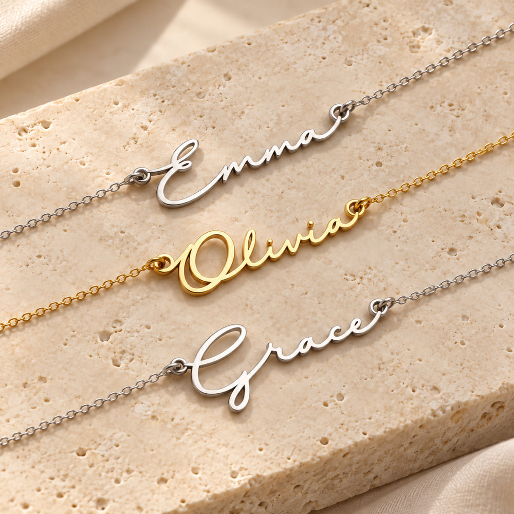 Three dainty name necklaces in gold and silver, each in fine script