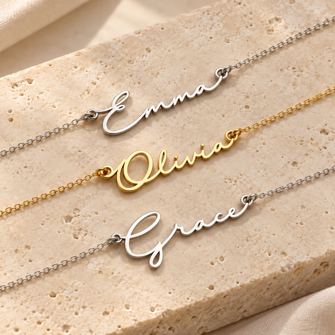Three dainty name necklaces in gold and silver, each in fine script