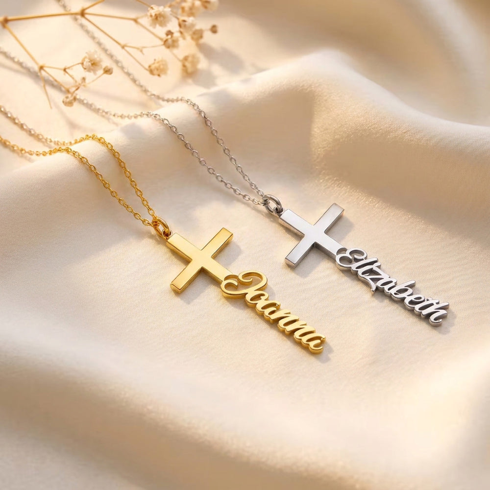 Gold and silver personalised cross necklaces with the names Joanna and Elizabeth in script